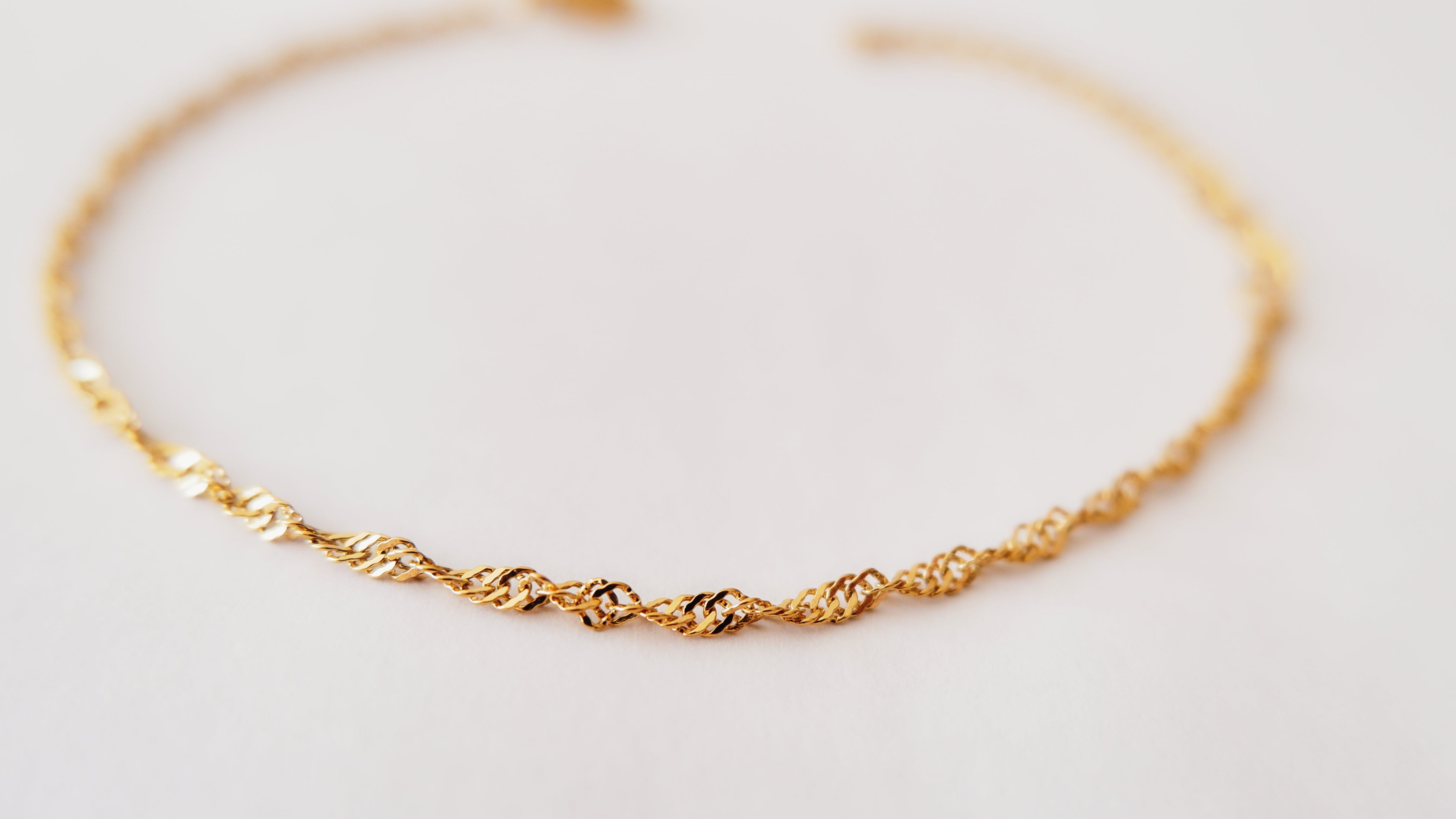 Gleam and durability meet in our gold-plated and stainless steel bracelet, a chic addition to your ensemble from our captivating jewellery collection.