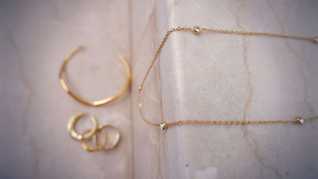 Experience the beauty of our gold-plated and stainless steel necklace, a radiant detail to your style from our captivating jewellery lineup.