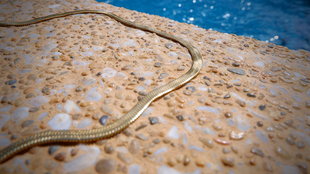 Elevate your elegance with our gold-plated and stainless steel necklace, a perfect complement to your ensemble from our diverse jewellery collection. 