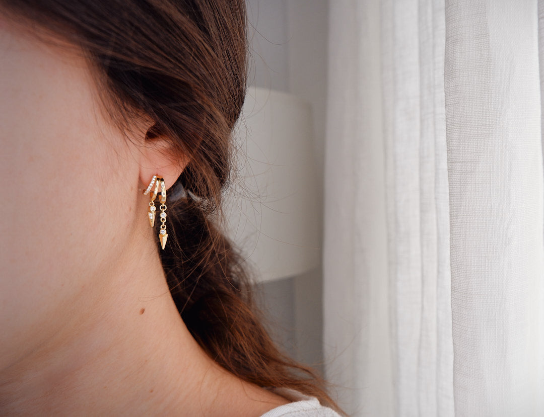 Radiate sophistication with gold-plated and silver earrings, a timeless addition to your look from our exquisite jewellery collection.