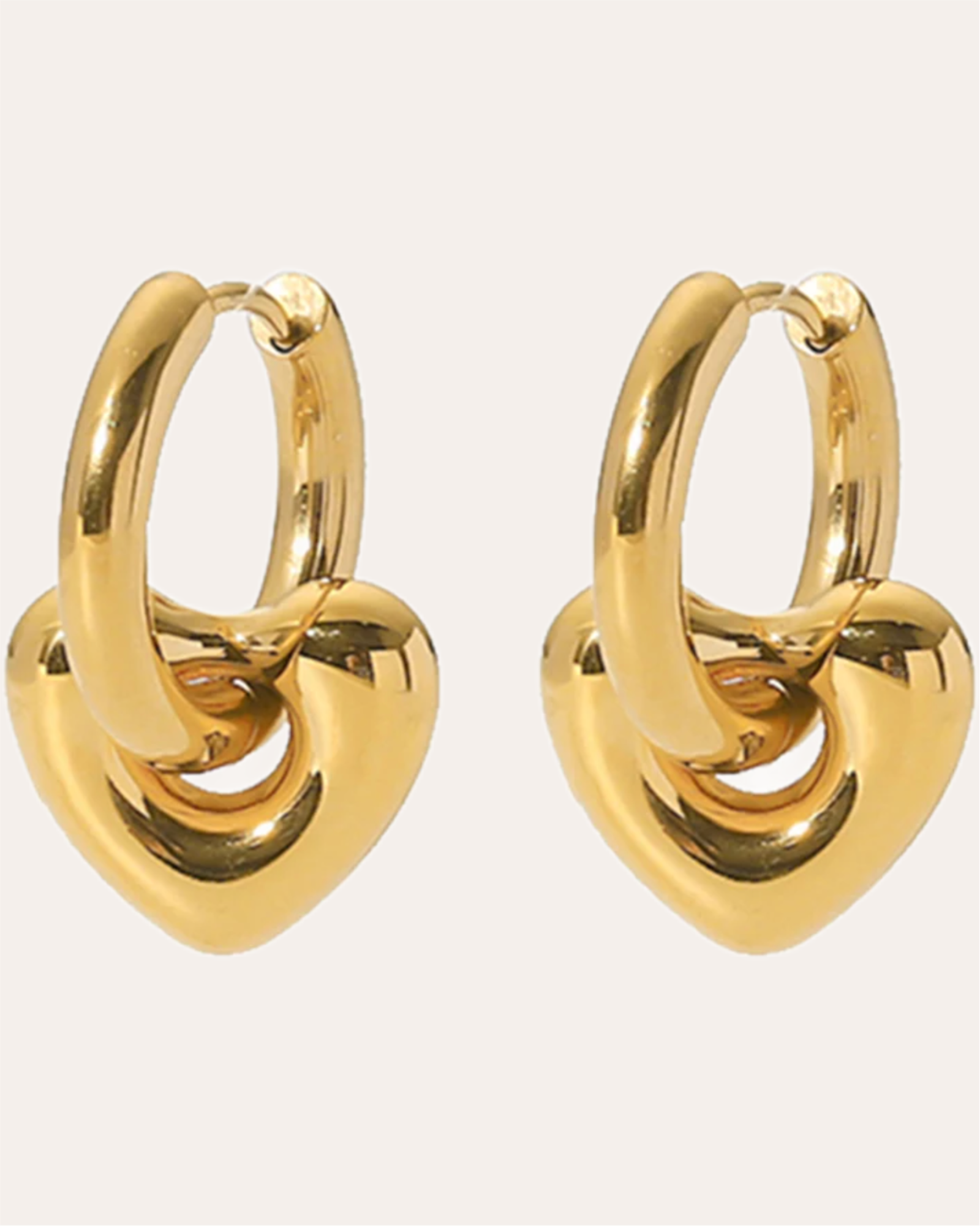Heart-shaped huggie earrings with a smooth, shiny finish.